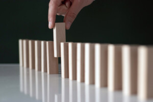 Removing a domino from a line of dominoes