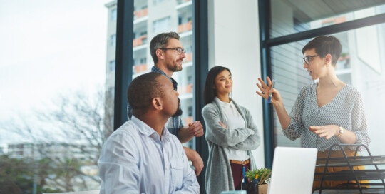 Cropped shot of a group of colleagues having a discussion in a modern office