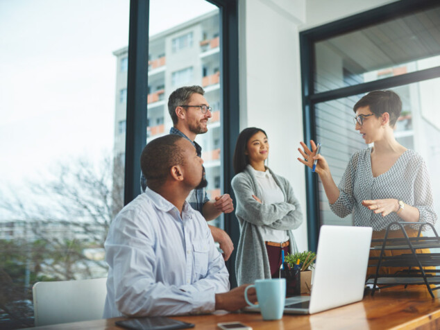 Cropped shot of a group of colleagues having a discussion in a modern office