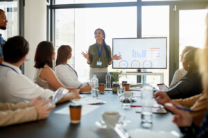 Woman presenting data in a meeting