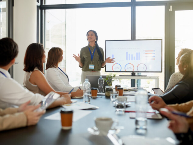 Woman presenting data in a meeting
