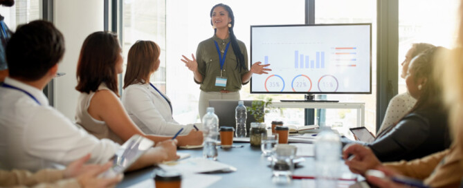 Woman presenting data in a meeting